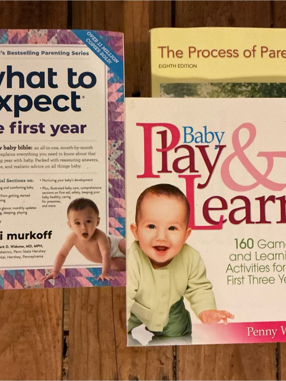 Parenting books. What to Expect, Baby Play & Learn, The Process of Parenting